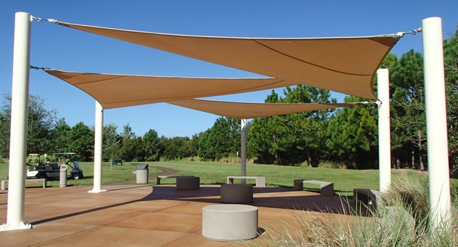 Designer shade sail installation over an outdoor entertainment area in Cape Town
